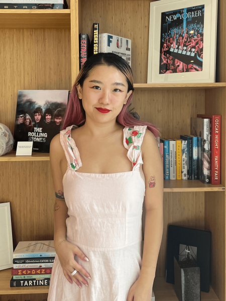 A frontview photo of Allure commerce editor Sarah Han wearing Cakes Sticky Cakes Circles underneath a light pink dress
